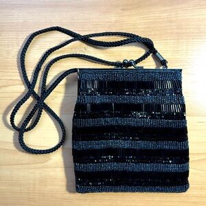 Lancome “Shimmering Black Handmade Beaded/ Purse with Cord strap.